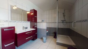 Shower, hair dryer, towels, toilet paper