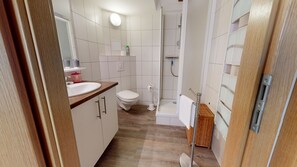 Shower, hair dryer, towels, toilet paper