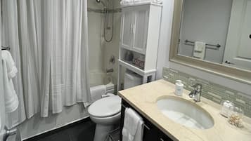 Combined shower/tub, hair dryer, towels, soap