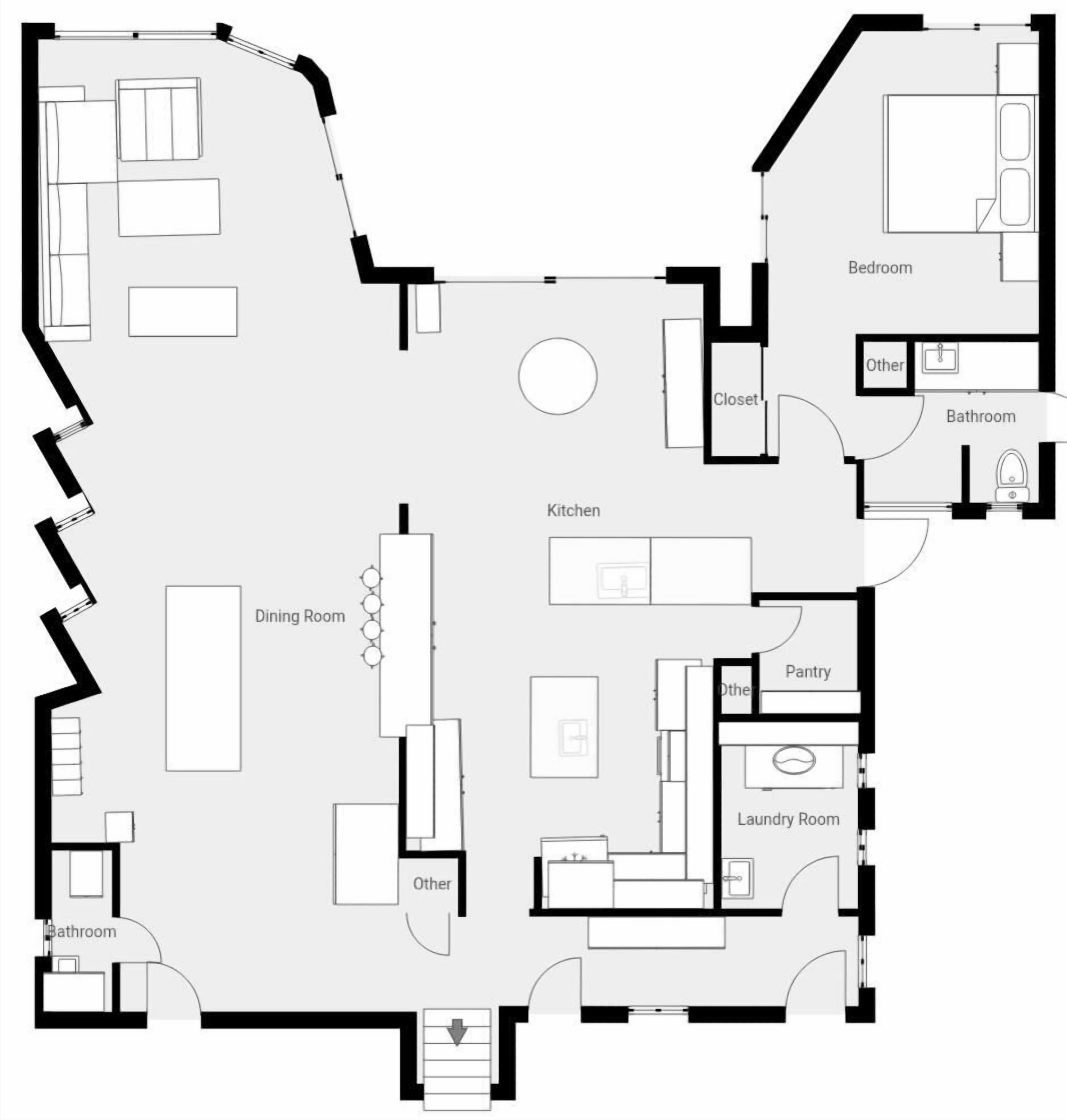 A floor plan with a dining room, kitchen, bathroom, bedroom, and laundry room.