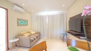 Standard Apartment | Living room | 43-inch Smart TV with digital channels, offices