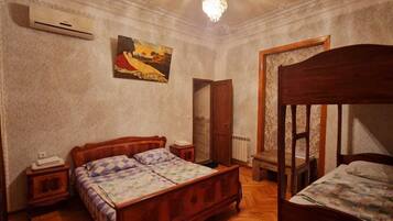 Standard Quadruple Room | Laptop workspace, blackout drapes, soundproofing, iron/ironing board