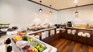 A buffet setup with various food items and utensils. - Best Western Hotel Fino Shin-Yokohama (Yokohama)