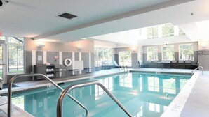 An indoor swimming pool with clear water, a lifeguard chair, and a no diving allowed sign. - Residence Inn by Marriott Richmond West/Midlothian (Richmond)