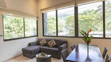 Family Apartment | Living area | 32-inch flat-screen TV with cable channels, TV