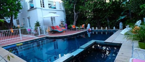 Outdoor pool, open 8:30 AM to 7:00 PM, pool loungers