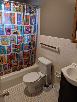 Combined shower/bathtub, towels, soap, toilet paper