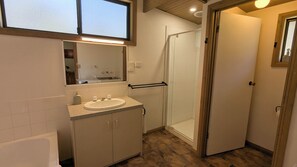 Separate tub and shower, hair dryer, towels, soap