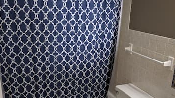 Combined shower/bathtub, towels, soap, toilet paper