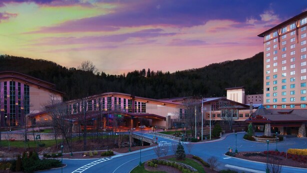 A hotel with a modern architectural design, featuring a central building with large windows and a covered walkway. - Relax in the Smokeys, Close to Everything (Whittier)