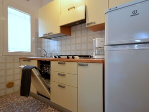 Microwave, dishwasher, high chair, dining tables
