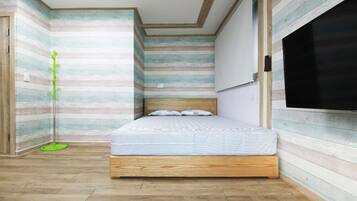 A bedroom with a wooden bed, striped wallpaper, and a large window.