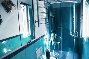 Shower, eco-friendly toiletries, hair dryer, towels