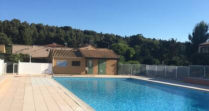 Charming fully-equipped house** in residence with swimming pool