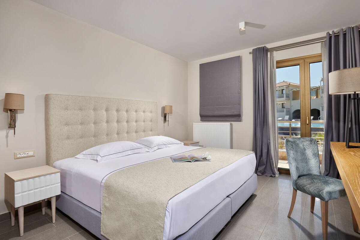 Premium bedding, desk, laptop workspace, blackout drapes