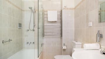 Shower, hair dryer, towels, shampoo