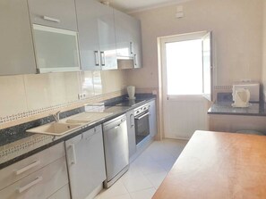 Microwave, dishwasher, coffee/tea maker, cookware/dishes/utensils