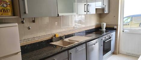 Microwave, dishwasher, coffee/tea maker, cookware/dishes/utensils