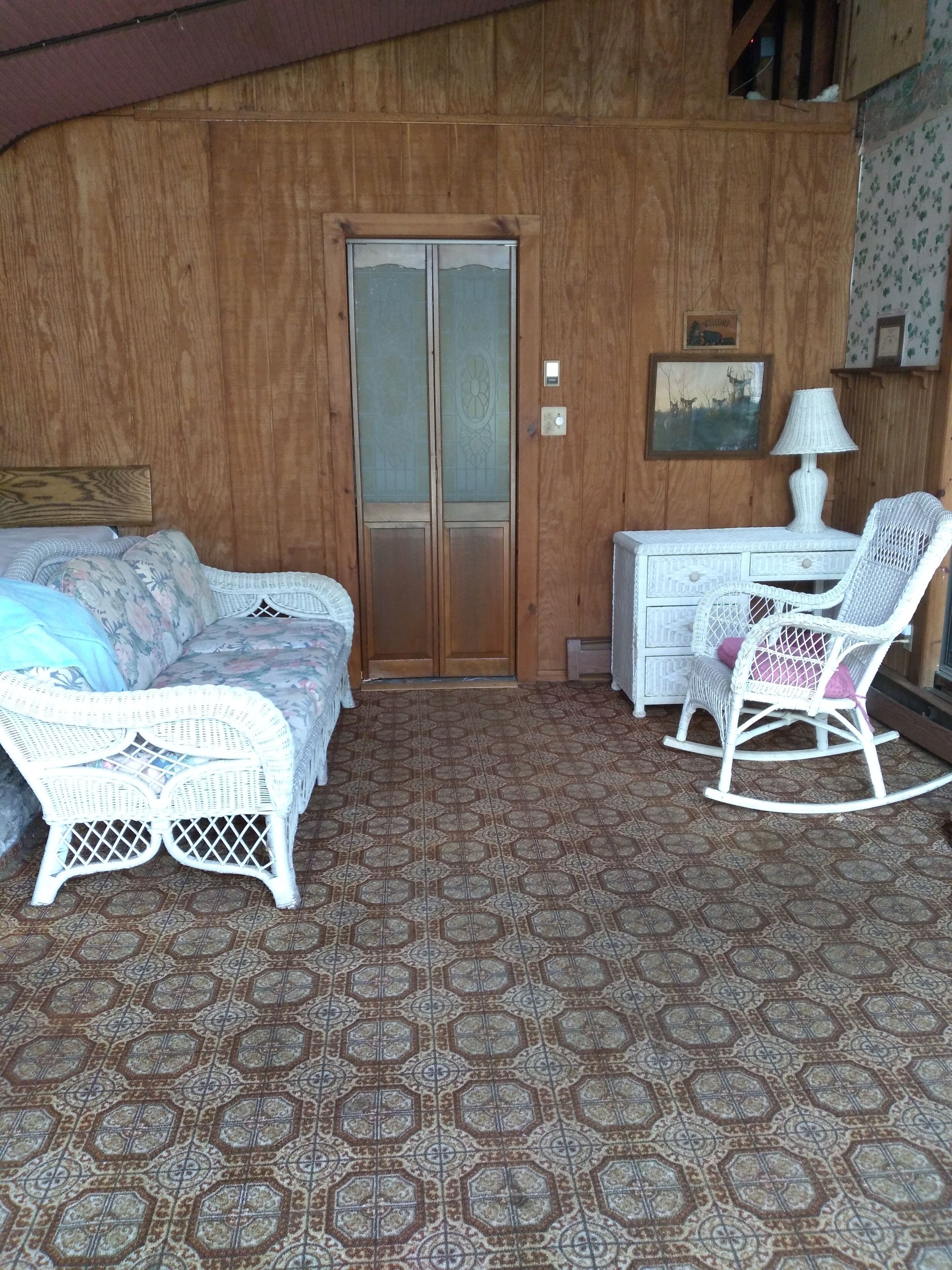 Sunroom entry adjacent to laundry room washer/dryer and first floor full bath