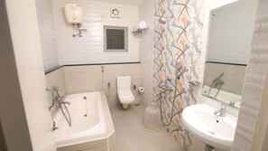 Deluxe Room | Bathroom | Shower, free toiletries, towels - Rithikha Inn (Chennai)