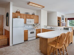 Microwave, dishwasher, dining tables