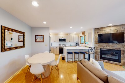 Premier lake view condo with hot tub, fireplace & great central location