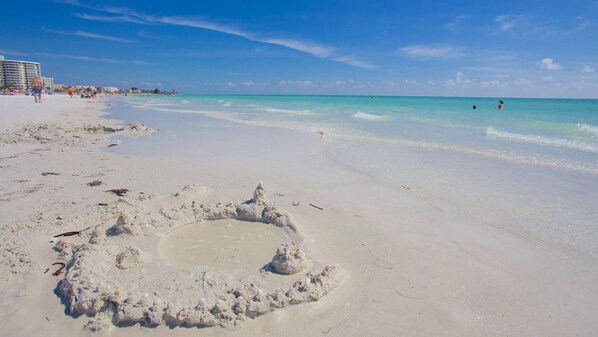 On the beach, sun-loungers, beach towels