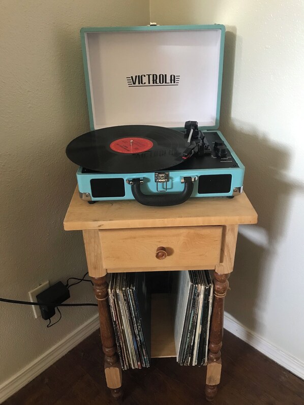 A vintage blue suitcase with a record player on top, placed on a wooden table with a drawer underneath. - Hillside Cottage: Restful, quiet setting
Coconino County Permit # STR-26-0572 (Flagstaff)