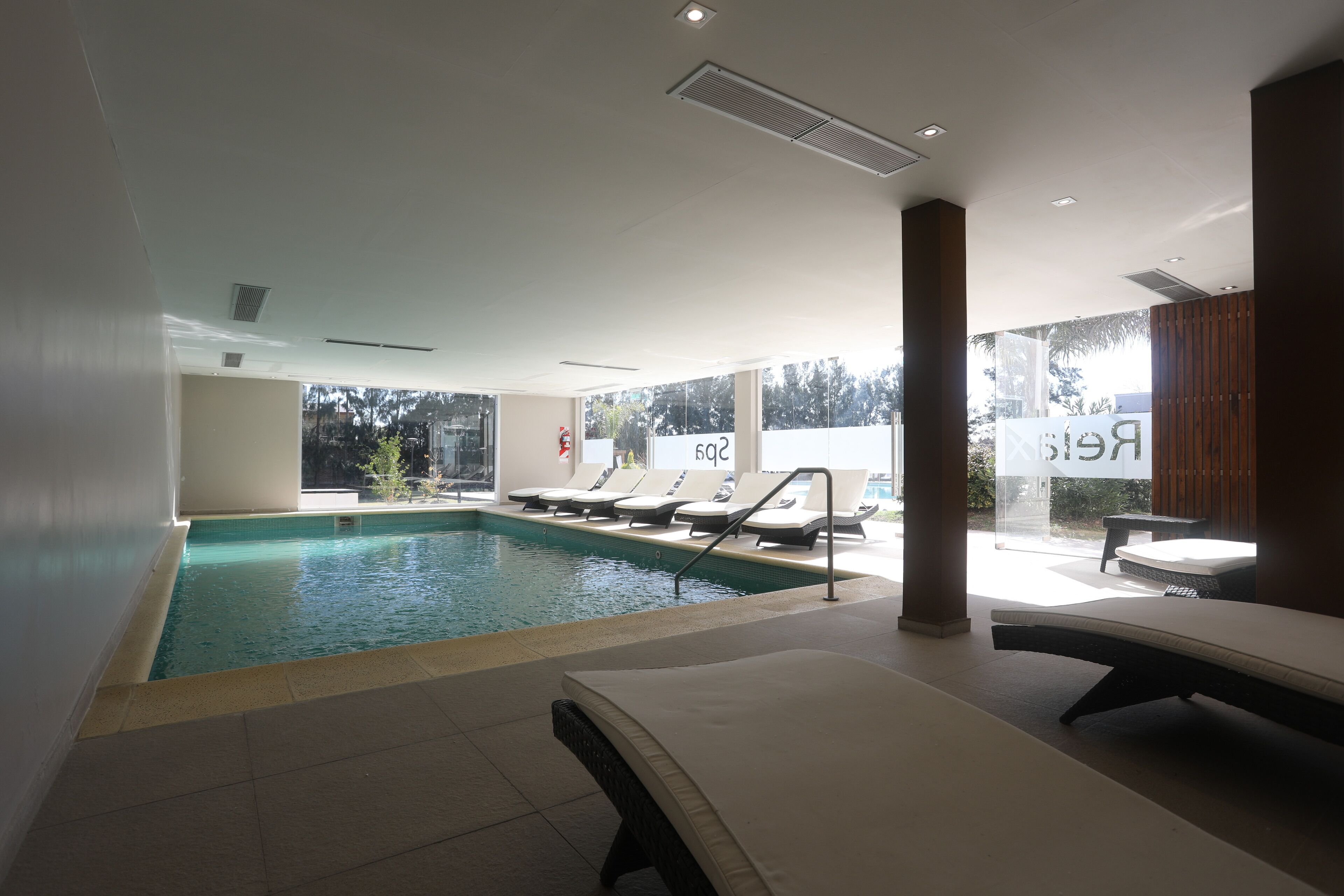 Indoor pool, outdoor pool, open 8:00 AM to 8:00 PM, pool loungers