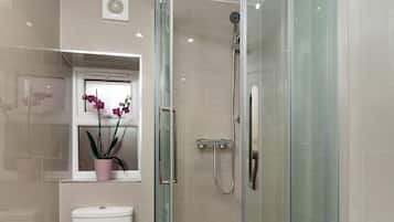 Shower, hair dryer, towels, soap