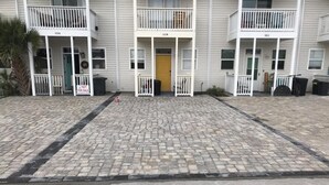 A building with a front entrance, a 'Not for Sale' sign, and a paved area in front. - Steps to the gorgeous Mexico Beach! (Mexico Beach)