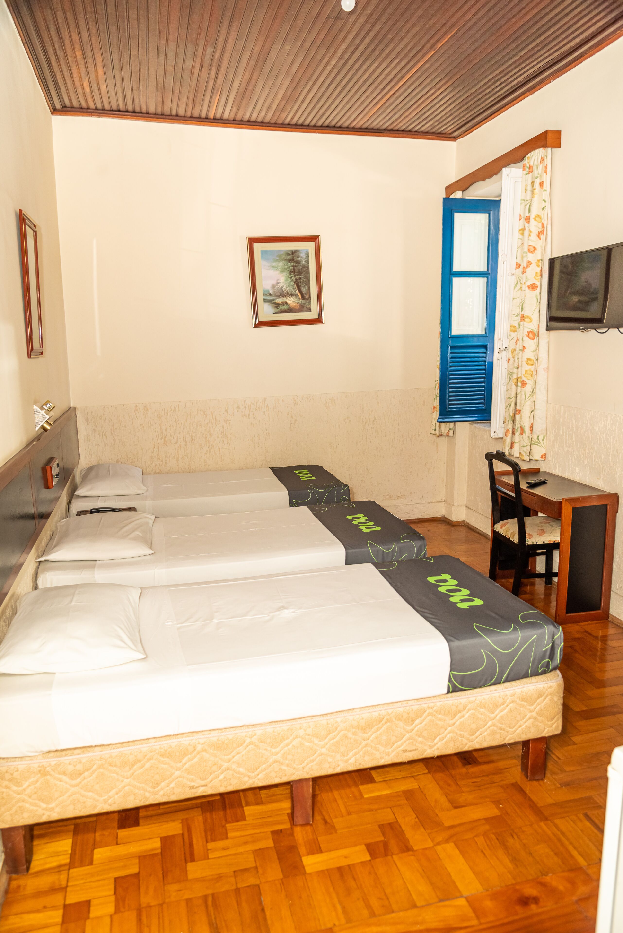 Standard Triple Room | Minibar, desk, laptop workspace, blackout drapes