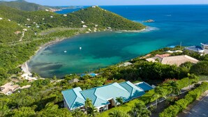An aerial view of a coastal property with a swimming pool, lush greenery, and a clear view of the ocean. - Southern Breeze: Expansive Ocean Views! Amazing Sunrises! (St. John)