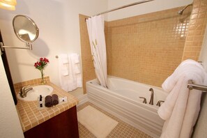 Jetted tub, hair dryer, towels, soap