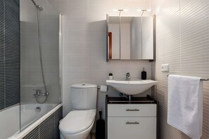 Bathtub, hair dryer, towels