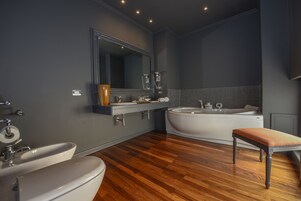 Executive Suite, 1 Bedroom, City View | Bathroom | Shower, free toiletries, hair dryer, slippers