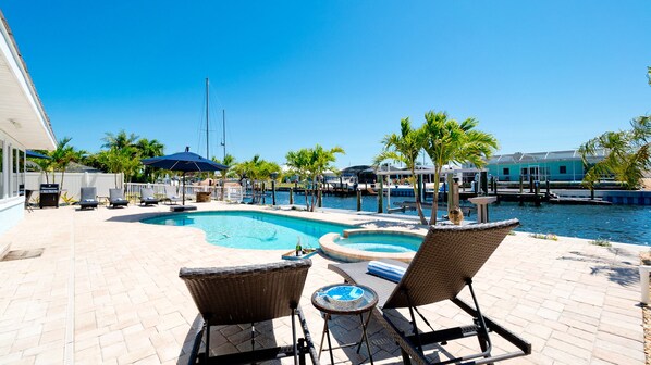 A heated pool, sun loungers