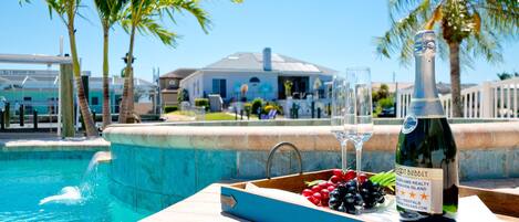 A heated pool, sun loungers