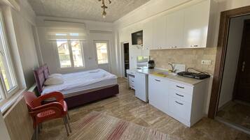 Standard Studio | Individually decorated, individually furnished, desk, laptop workspace