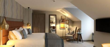 A modern hotel room with a large bed, a desk, a chair, and a TV mounted on the wall.