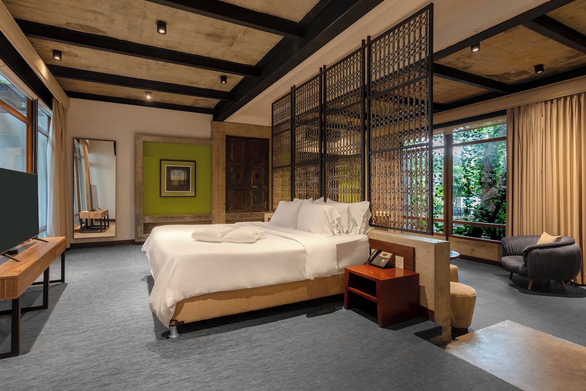 Suite Deluxe | Roupas de cama premium, edredons de pluma, frigobar, cofres nos quartos