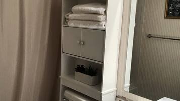Combined shower/tub, hair dryer, towels, soap