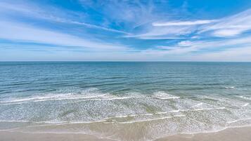 On the beach, sun loungers, beach towels