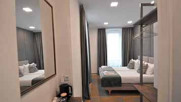 Deluxe Double or Twin Room | Desk, blackout drapes, iron/ironing board, free cribs/infant beds