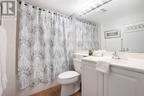Combined shower/bathtub, hair dryer, towels, soap