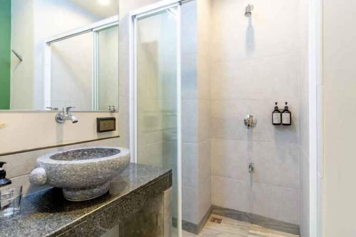 Bathroom | Shower, hair dryer, slippers, towels