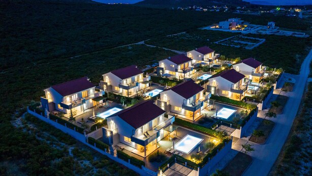 A modern residential complex with multiple two-story houses, each featuring a swimming pool and outdoor seating areas. - Amazing home in Debeljak (Debeljak)