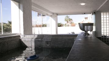 Relax by the pool with a clear view of the surrounding landscape.