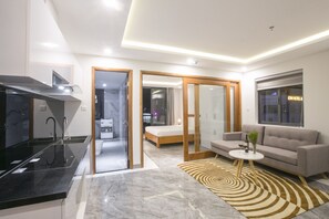 Deluxe Double Room, Balcony, City View | Living area | 29-inch flat-screen TV with cable channels, TV