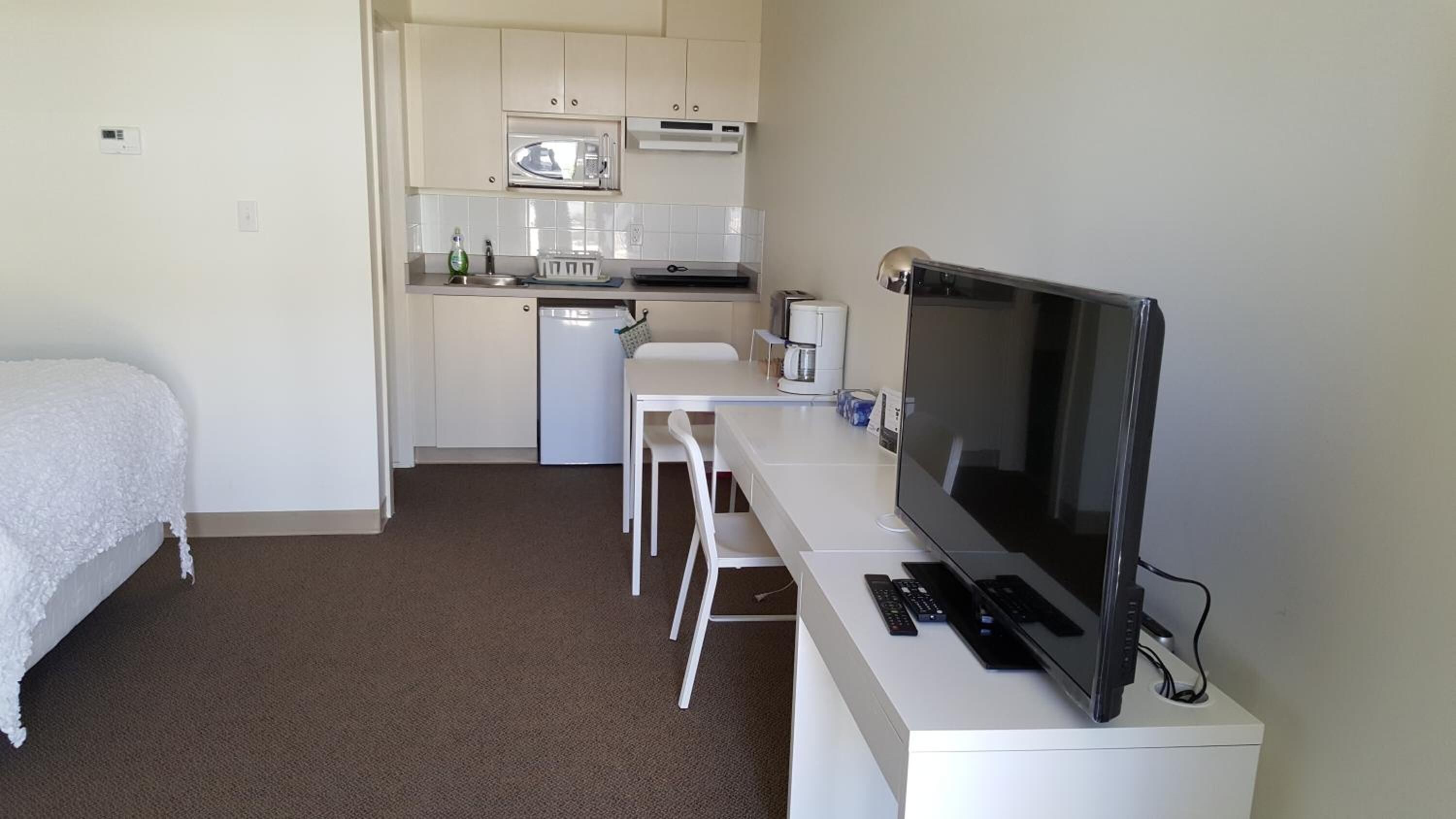 Desk, laptop workspace, free WiFi, bed sheets